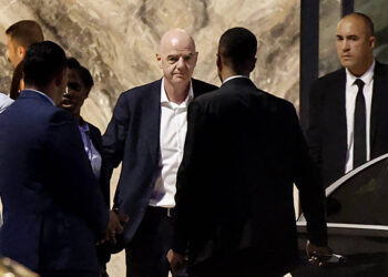 President Gianni Infantino (C) leaves Al-Madina Stadium in Rabat following the 2026 Women's Africa Cup of Nations match between Malawi and Zambia on August 5, 2026. Infantino, under fire for a now shelved plan to open the World Cup to private investment, earlier held emergency talks in Morocco with directors of the world football governing body.
FIFA then issued an apology while reaffirming its "full support" for Infantino. In a statement, the leadership acknowledged "that errors were also made after the proposal was leaked to media". (Photo by Abdelmajid BZIOUAT / AFP via Getty Images)