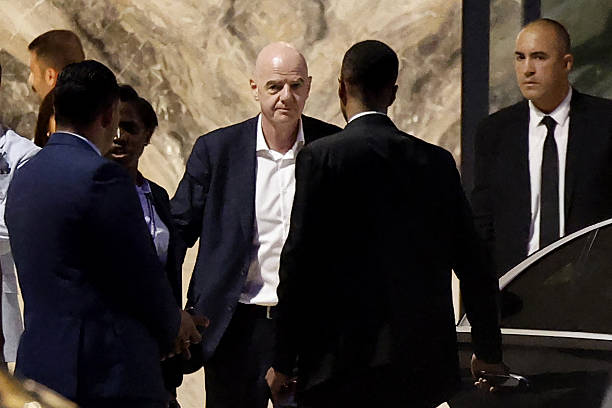 President Gianni Infantino (C) leaves Al-Madina Stadium in Rabat following the 2026 Women's Africa Cup of Nations match between Malawi and Zambia on August 5, 2026. Infantino, under fire for a now shelved plan to open the World Cup to private investment, earlier held emergency talks in Morocco with directors of the world football governing body.
FIFA then issued an apology while reaffirming its "full support" for Infantino. In a statement, the leadership acknowledged "that errors were also made after the proposal was leaked to media". (Photo by Abdelmajid BZIOUAT / AFP via Getty Images)