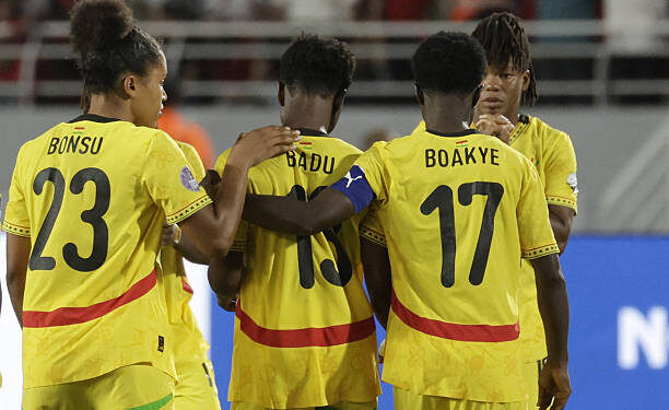 Ghana's midfielder #23 Josephine Afua Kyerewaa Bonsu and defender #17 Portia Boakye console their forward #13 Evelyn Badu after missing a shot in the penalty shootout at the end of their 2025 Women's Africa Cup of Nations semi-final football match against Morocco at Prince Moulay Abdellah Stadium in Rabat on July 22, 2025. (Photo by Abdel Majid BZIOUAT / AFP) (Photo by ABDEL MAJID BZIOUAT/AFP via Getty Images)