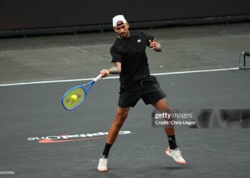 Nick Kyrgios of Australia returns a shot against Alexander Bublik of Kazakhstan during round one of The MGM Slam (Photo by Chris Unger/Getty Images)