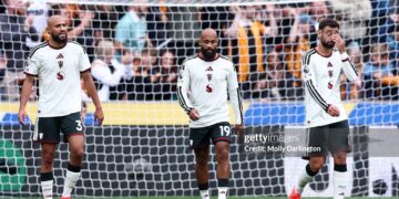 (L-R) Noussair Mazraoui, Bryan Mbeumo and Bruno Fernandes of Manchester United react after their side concedes a goal during the Premier League 2026/27 match between Hull City and Manchester United (Photo by Molly Darlington/Getty Images)