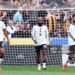 (L-R) Noussair Mazraoui, Bryan Mbeumo and Bruno Fernandes of Manchester United react after their side concedes a goal during the Premier League 2026/27 match between Hull City and Manchester United (Photo by Molly Darlington/Getty Images)