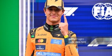 McLaren's British driver Lando Norris celebrates his pole position after the qualifying race of the Formula One Dutch Grand Prix at The Circuit (Photo by JOHN THYS / AFP via Getty Images)