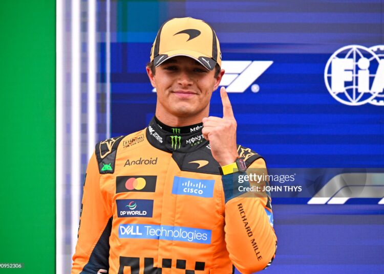 McLaren's British driver Lando Norris celebrates his pole position after the qualifying race of the Formula One Dutch Grand Prix at The Circuit (Photo by JOHN THYS / AFP via Getty Images)