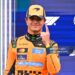 McLaren's British driver Lando Norris celebrates his pole position after the qualifying race of the Formula One Dutch Grand Prix at The Circuit (Photo by JOHN THYS / AFP via Getty Images)