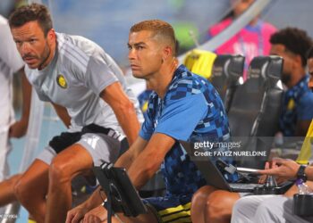 Nassr's Portuguese forward #07 Cristiano Ronaldo sits on the bench before the start of the Saudi Pro League (Photo by Fayez NURELDINE / AFP via Getty Images)
