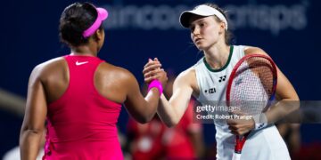 Elena Rybakina of Kazakhstan and Naomi Osaka of Japan shake hands at the net after the quarter-final (Photo by Robert Prange/Getty Images)