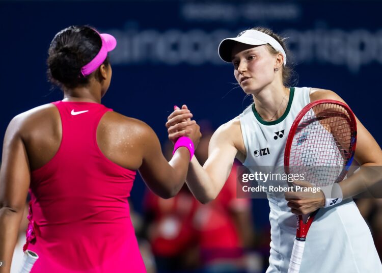 Elena Rybakina of Kazakhstan and Naomi Osaka of Japan shake hands at the net after the quarter-final (Photo by Robert Prange/Getty Images)