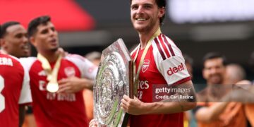 Declan Rice of Arsenal holds the FA Community Shield trophy after his team’s victory in the 2026 FA Community Shield match between Arsenal and Manchester City (Photo by Carl Recine/Getty Images)