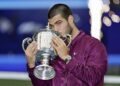 Carlos Alcaraz of Spain kisses the victor's trophy after winning the men's singles title at the U.S. Open tennis tournament in New York on Sept. 7, 2025. (Photo by Kyodo News via Getty Images)