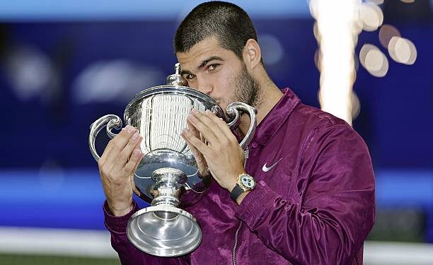 Carlos Alcaraz of Spain kisses the victor's trophy after winning the men's singles title at the U.S. Open tennis tournament in New York on Sept. 7, 2025. (Photo by Kyodo News via Getty Images)