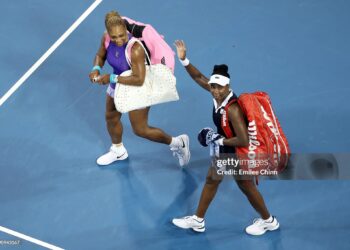 Venus Williams and Serena Williams of the United States wave to fans as they walk off the court after a match against Marta Kostyuk of Czechia and Peyton Stearns of the United States on day seven of the Cincinnati Open (Photo by Emilee Chinn/Getty Images)