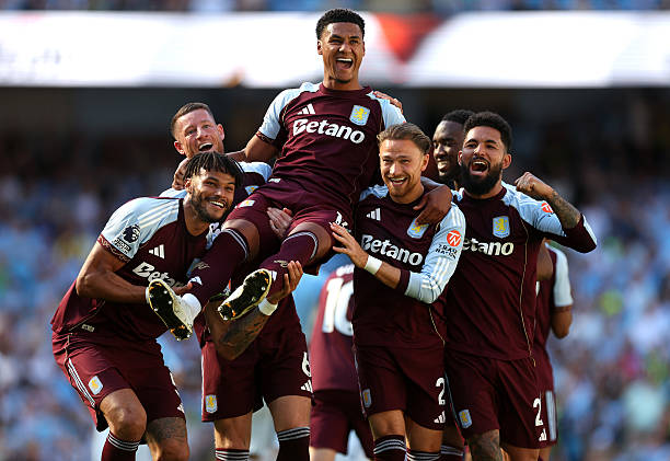 Ollie Watkins of Aston Villa is carried by teammates as he celebrates scoring his team's second goal during the Premier League match between Manchester City and Aston Villa at the Etihad Stadium on May 24, 2026 in Manchester, England. (Photo by Neville Williams/Aston Villa FC via Getty Images)