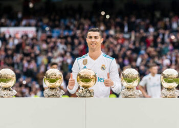 MADRID, SPAIN - DECEMBER 09: Cristiano Ronaldo of Real Madrid poses for photos with his FIFA Ballon Dor Trophies during the La Liga 2017-18 match between Real Madrid and Sevilla FC at Santiago Bernabeu Stadium on 09 December 2017 in Madrid, Spain. (Photo by Power Sport Images/Getty Images)
