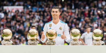 MADRID, SPAIN - DECEMBER 09: Cristiano Ronaldo of Real Madrid poses for photos with his FIFA Ballon Dor Trophies during the La Liga 2017-18 match between Real Madrid and Sevilla FC at Santiago Bernabeu Stadium on 09 December 2017 in Madrid, Spain. (Photo by Power Sport Images/Getty Images)