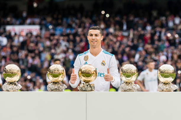 MADRID, SPAIN - DECEMBER 09: Cristiano Ronaldo of Real Madrid poses for photos with his FIFA Ballon Dor Trophies during the La Liga 2017-18 match between Real Madrid and Sevilla FC at Santiago Bernabeu Stadium on 09 December 2017 in Madrid, Spain. (Photo by Power Sport Images/Getty Images)
