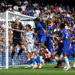 Emiliano Martinez of Chelsea attempts to make a save under pressure from Mats Wieffer of Brighton & Hove Albion during the Premier League 2026/27 match between Chelsea FC and Brighton & Hove Albion at Stamford Bridge on August 30, 2026 in London, England. (Photo by Mike Hewitt/Getty Images)