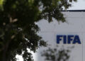 The FIFA logo is seen at its Africa regional office in Sale on August 5, 2026. President Gianni Infantino held emergency talks with other FIFA directors in Morocco on August 5, a source told AFP, amid a wave of criticism over his now shelved plan to open the World Cup to private investment. (Photo by Abdelmajid BZIOUAT / AFP via Getty Images)