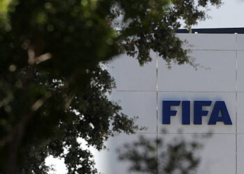The FIFA logo is seen at its Africa regional office in Sale on August 5, 2026. President Gianni Infantino held emergency talks with other FIFA directors in Morocco on August 5, a source told AFP, amid a wave of criticism over his now shelved plan to open the World Cup to private investment. (Photo by Abdelmajid BZIOUAT / AFP via Getty Images)
