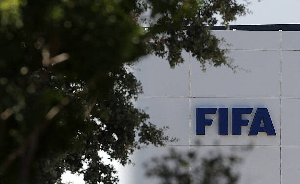 The FIFA logo is seen at its Africa regional office in Sale on August 5, 2026. President Gianni Infantino held emergency talks with other FIFA directors in Morocco on August 5, a source told AFP, amid a wave of criticism over his now shelved plan to open the World Cup to private investment. (Photo by Abdelmajid BZIOUAT / AFP via Getty Images)