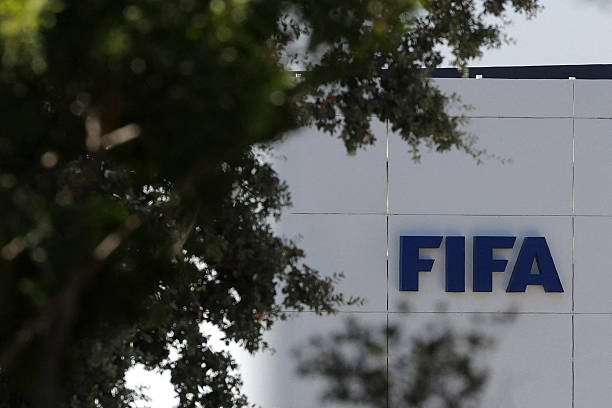 The FIFA logo is seen at its Africa regional office in Sale on August 5, 2026. President Gianni Infantino held emergency talks with other FIFA directors in Morocco on August 5, a source told AFP, amid a wave of criticism over his now shelved plan to open the World Cup to private investment. (Photo by Abdelmajid BZIOUAT / AFP via Getty Images)