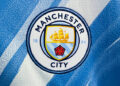Manchester City logo is seen on a jersey at the store in Krakow, Poland on July 13, 2026. (Photo by Jakub Porzycki/NurPhoto via Getty Images)