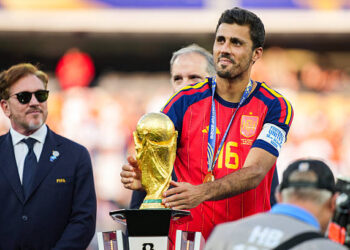 Rodri #9 of Spain picks up the FIFA World Cup Winner’s Trophy after defeating Argentina in the FIFA World Cup 2026 Final at New York New Jersey Stadium on July 19, 2026 in East Rutherford, New Jersey. Spain defeated reigning World Cup champions Argentina, who were led by Lionel Messi, with the lone goal coming from Ferran Torres #7 in the 106th minute of extra time. (Photo by Andrew Harnik/Getty Images)
