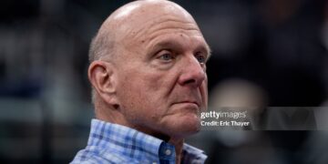 LA Clippers owner Steve Ballmer sits on the sideline before an NBA basketball game against the San Antonio Spurs (Eric Thayer / Los Angeles Times via Getty Images)