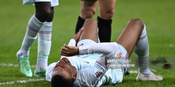France's forward #10 Kylian Mbappe reacts after scoring the opening goal and to a leg pain during the UEFA Nations League (League A, Group 1) first leg football match between Turkey and France (Photo by OZAN KOSE / AFP via Getty Images)