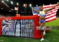 Masai Russell celebrates after winning and breaking the world record in the women's 100m hurdles during the IAAF Diamond League athletics meeting (Photo by Stefan Wermuth / AFP via Getty Images)