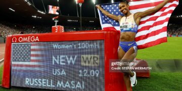 Masai Russell celebrates after winning and breaking the world record in the women's 100m hurdles during the IAAF Diamond League athletics meeting (Photo by Stefan Wermuth / AFP via Getty Images)