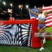 Masai Russell celebrates after winning and breaking the world record in the women's 100m hurdles during the IAAF Diamond League athletics meeting (Photo by Stefan Wermuth / AFP via Getty Images)