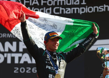 Race winner Andrea Kimi Antonelli of Italy and Mercedes AMG Petronas F1 Team celebrates on the podium with his national flag during the F1 Grand Prix of Italy at Autodromo Nazionale Monza on September 06, 2026 in Monza, Italy. (Photo by Clive Rose/Getty Images)