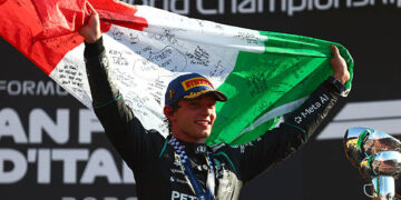 Race winner Andrea Kimi Antonelli of Italy and Mercedes AMG Petronas F1 Team celebrates on the podium with his national flag during the F1 Grand Prix of Italy at Autodromo Nazionale Monza on September 06, 2026 in Monza, Italy. (Photo by Clive Rose/Getty Images)