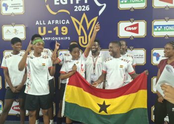 The team posing for a picture after win