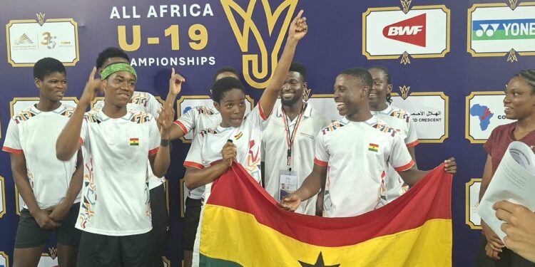 The team posing for a picture after win
