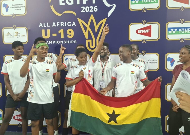 The team posing for a picture after win