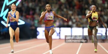 (L-R) Amy Hunt of Team Great Britain, Melissa Jefferson-Wooden of Team United States, and Ashanti Moore of Team Jamaica, compete in the Women's 200m Final on Day 3 of the World Athletics Ultimate Championship (Photo by Matthias Hangst/Getty Images)