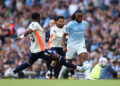 MANCHESTER, ENGLAND - SEPTEMBER 05: Antoine Semenyo of Manchester City passes the ball under pressure from Jay Dasilva and Ephron Mason-Clark of Coventry City during the Premier League 2026/27 match between Manchester City and Coventry City at Etihad Stadium on September 05, 2026 in Manchester, England. (Photo by Carl Recine/Getty Images)