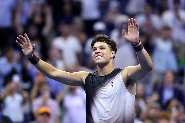 NEW YORK, NEW YORK - SEPTEMBER 08: Ben Shelton of the United States celebrates match point against Carlos Alcaraz of Spain during their Men's Singles Quarterfinal match on Day Ten of the 2026 US Open at USTA Billie Jean King National Tennis Center on September 08, 2026 in the Flushing neighborhood of the Queens borough of New York City. (Photo by Julian Finney/Getty Images)