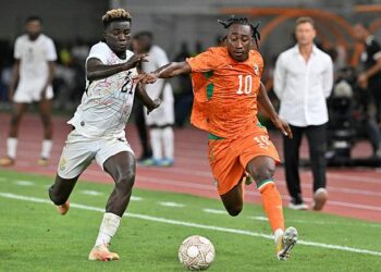 Ivory Coast's forward #10 Yan Diomandé (R) fights for the ball with Ghana's defender #21 Kojo Peprah Oppong during the Africa Cup of Nations 2027 qualifying football match between Ivory Coast and Ghana at the Stade de Bouake on September 24, 2026. (Photo by Issouf SANOGO / AFP via Getty Images)
