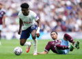 Mohammed Kudus of Tottenham Hotspur competes with George Hemmings of Aston Villa during the Premier League match between Tottenham Hotspur and Aston Villa at Tottenham Hotspur Stadium in London, United Kingdom, on September 19, 2026. (Photo by Harvey Murphy/News Images/NurPhoto via Getty Images)
