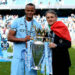 Vincent Kompany the captain of Manchester City and Roberto Mancini the manager of Manchester City pose with the trophy following the Barclays Premier League match between Manchester City and Queens Park Rangers at the Etihad Stadium on May 13, 2012 in Manchester, England. (Photo by Alex Livesey/Getty Images)