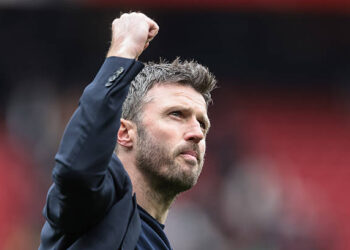 Michael Carrick, manager of Manchester United, celebrates with fans as they chant his name following the 3-2 win during the Premier League match between Manchester United and Liverpool at Old Trafford, Manchester, United Kingdom, on May 3, 2026. (Photo by Mark Cosgrove/News Images/NurPhoto via Getty Images)