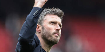 Michael Carrick, manager of Manchester United, celebrates with fans as they chant his name following the 3-2 win during the Premier League match between Manchester United and Liverpool at Old Trafford, Manchester, United Kingdom, on May 3, 2026. (Photo by Mark Cosgrove/News Images/NurPhoto via Getty Images)