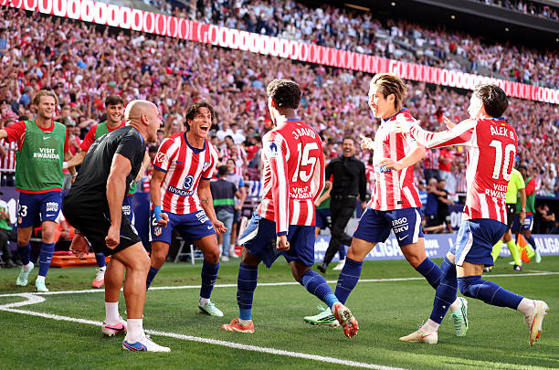 Jonathan David of Atletico Madrid celebrates scoring his team’s second goal with teammates during the LaLiga EA Sports 2026/27 match between Atletico de Madrid and Real Madrid at Riyadh Air Metropolitano on September 20, 2026 in Madrid, Spain. (Photo by Florencia Tan Jun/Getty Images)