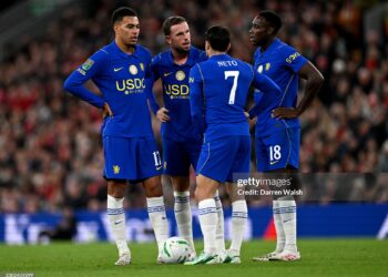 Morgan Rogers, Jordan Henderson, Pedro Neto and Danny Welbeck of Chelsea talk while standing over a freekick during the Carabao Cup Fourth Round match between Liverpool and Chelsea (Photo by Darren Walsh/Chelsea FC via Getty Images)