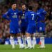 Morgan Rogers, Jordan Henderson, Pedro Neto and Danny Welbeck of Chelsea talk while standing over a freekick during the Carabao Cup Fourth Round match between Liverpool and Chelsea (Photo by Darren Walsh/Chelsea FC via Getty Images)