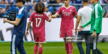 Marc Cucurella of Real Madrid CF and Carlos Espi of Real Madrid CF gestures during the during the Pre-Season Friendly match between FC Schalke 04 and Real Madrid (Photo by Mario Hommes/DeFodi Images/DeFodi via Getty Images)