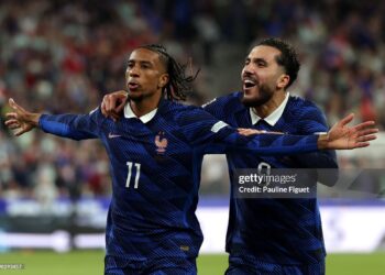Michael Olise of France celebrates scoring his team’s first goal with teammate Rayan Cherki during the UEFA Nations League 2026/27 group phase match between France and Italy (Photo by Pauline Figuet/Getty Images)
